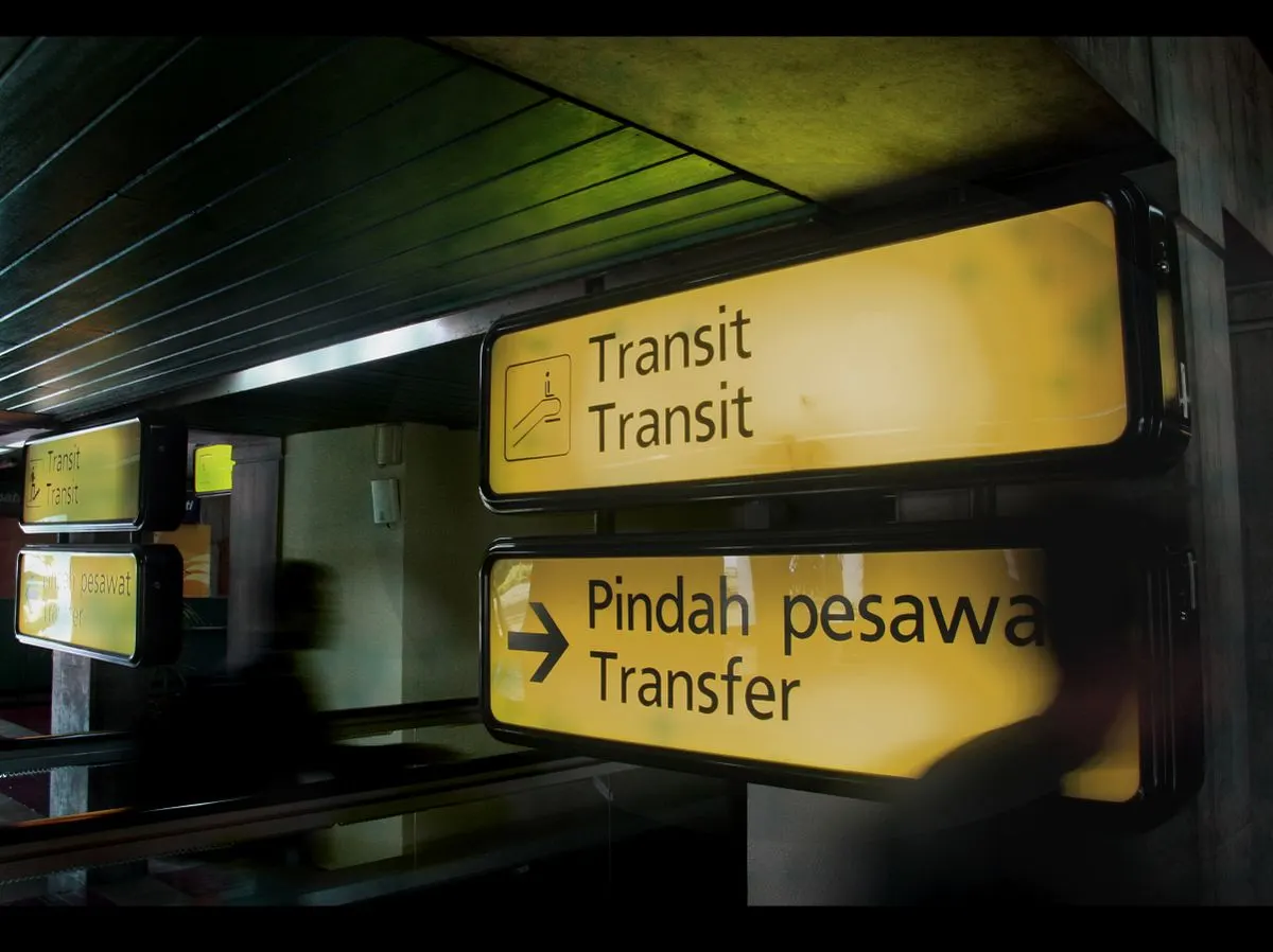 Illuminated transit signs at an airport in Banten, Indonesia, guiding passengers. - Photo by…