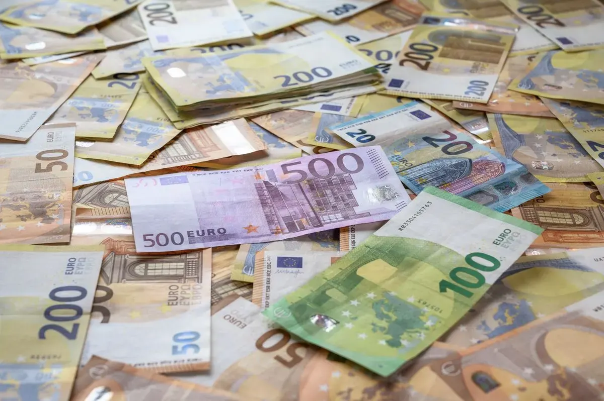 A collection of Euro banknotes representing wealth, savings, and European economy. - Photo by…