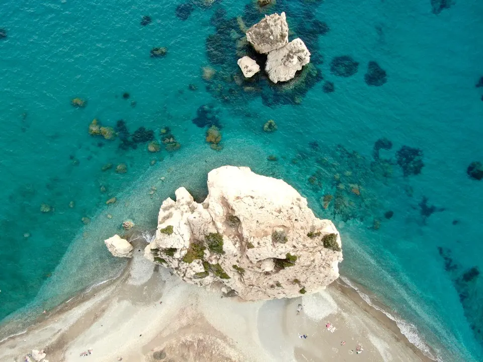 Stunning aerial shot of a rock formation on a pristine Cyprus beach with turquoise waters. -…