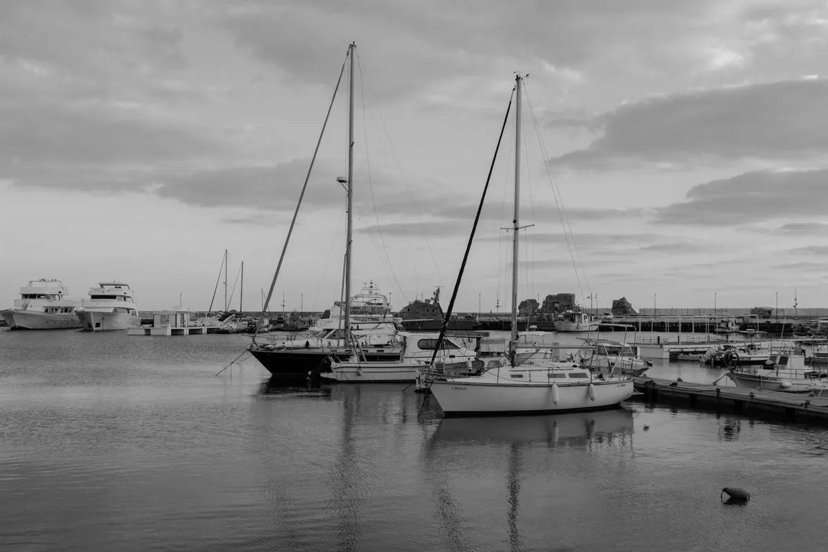 Monochrome view of sailboats and yachts moored in Paphos harbor, Cyprus. - Photo by Viktoriia…