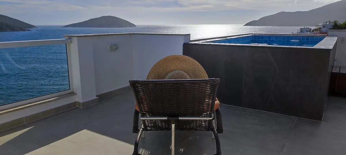 Experience serene ocean views from a luxurious rooftop terrace in Arraial do Cabo, Brazil. -…