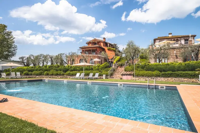 Stunning mansion with a pool and lush garden setting, ideal for summer vacations. - Photo by…