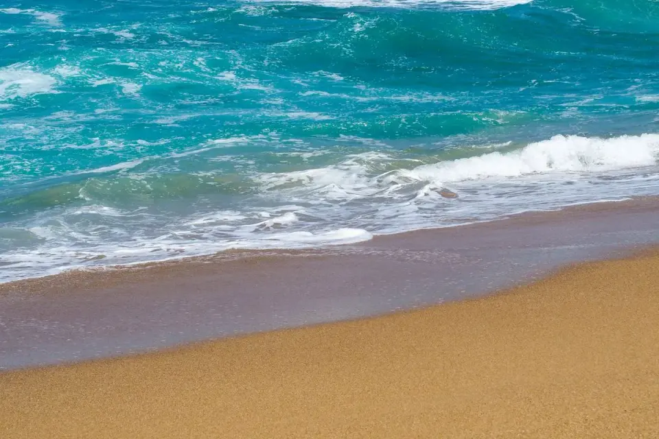 Calm waves lapping on a sandy beach in Oaxaca, Mexico. Tranquil coastal scene. - Photo by V Bawa…