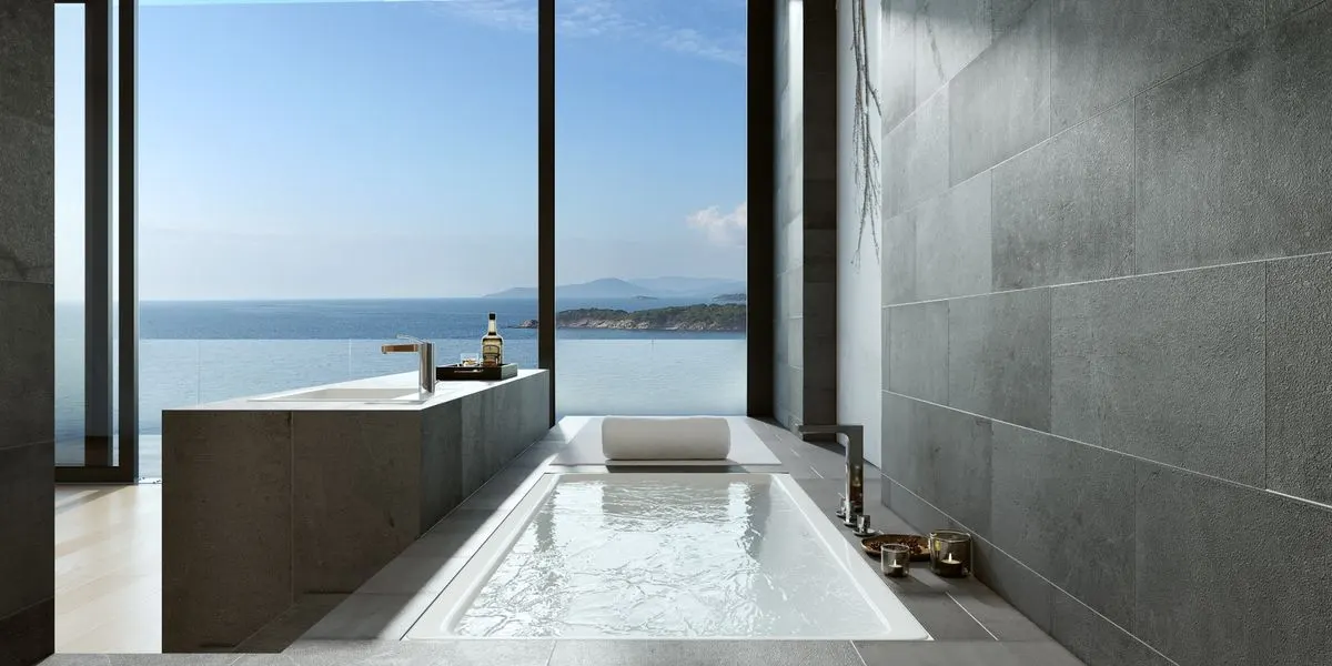 Luxurious minimalist bathroom with ocean view through large windows in Bodrum, Turkey, ideal for…