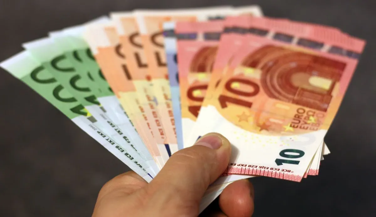 A fan of euro banknotes in various denominations held in a hand. - Photo by Pixabay on Pexels