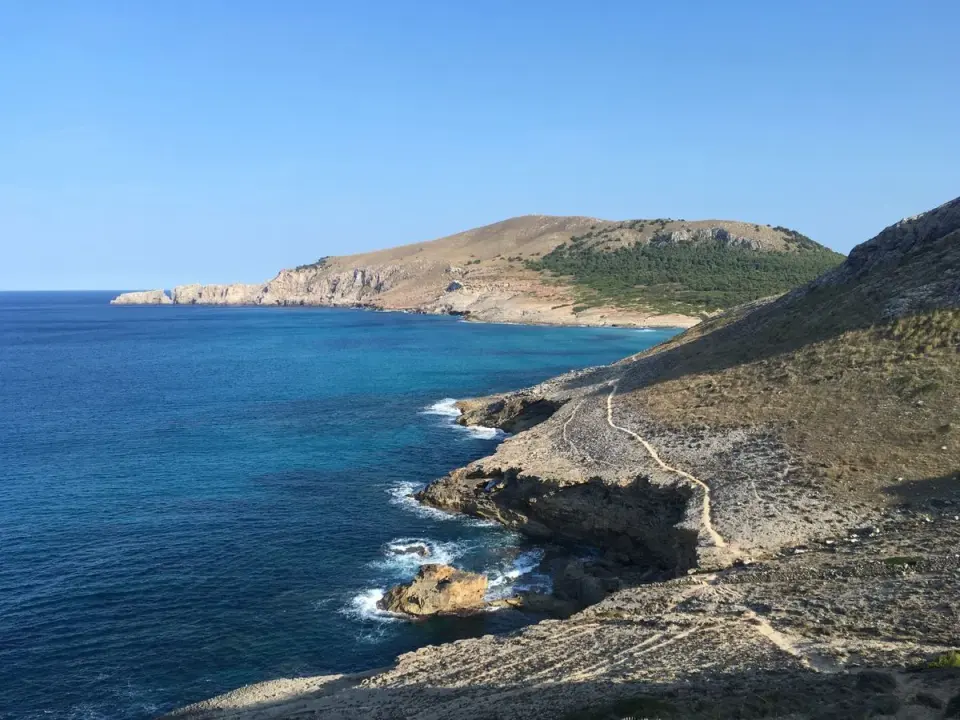 Scenic view of the rugged coastline and clear blue waters near Cala Mesquida, Mallorca. - Photo…