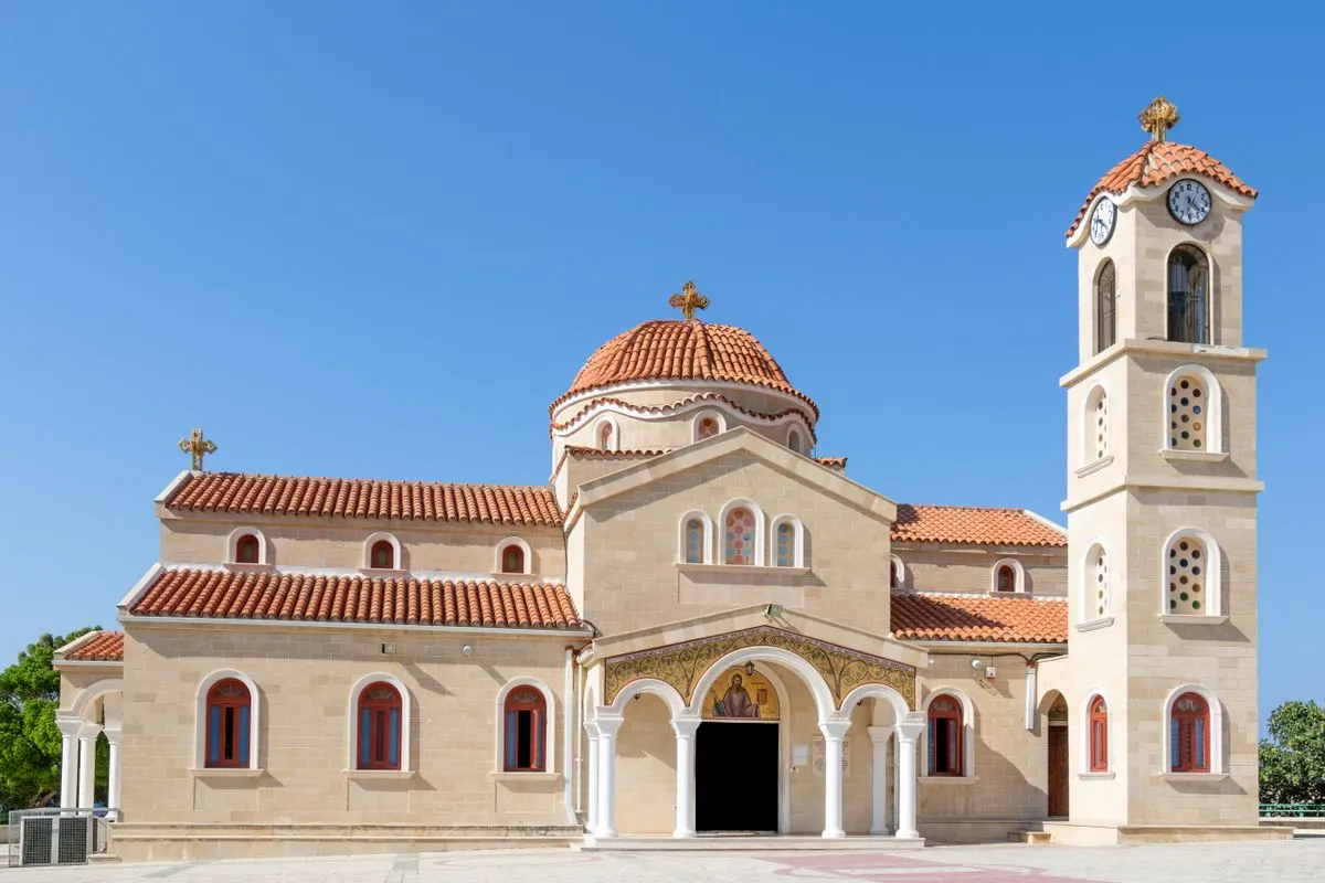 Beautiful view of Agios Raphael Church with its stunning facade under a clear blue sky in…